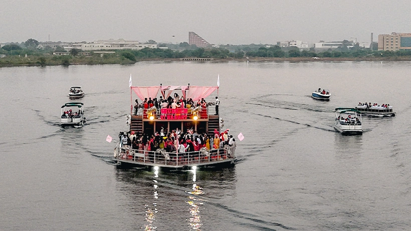 groom’s majestic entry by boat
